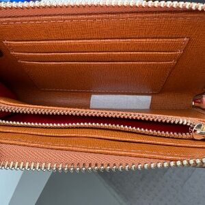 Brand new Dooney and Bourke wristlet